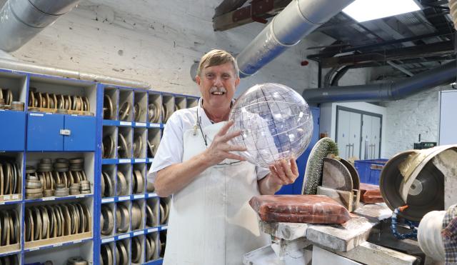 Master Cutter Tom Power holding a crystal basketball